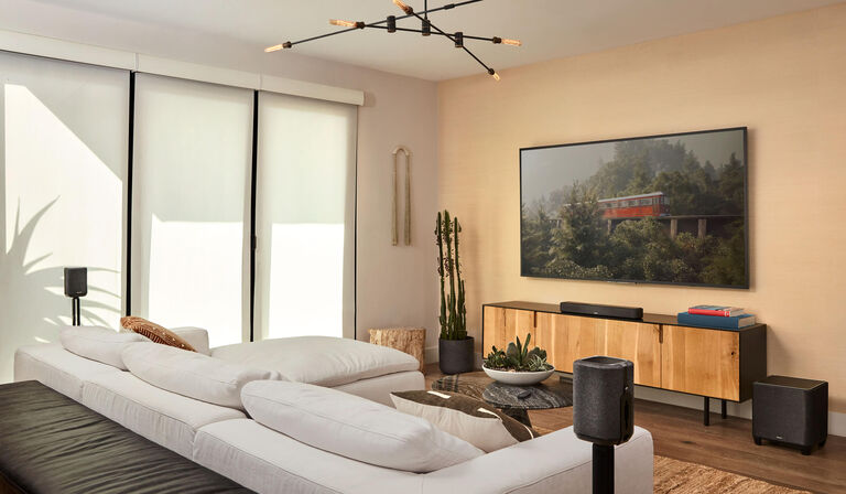 a wireless home theater set up in a living room