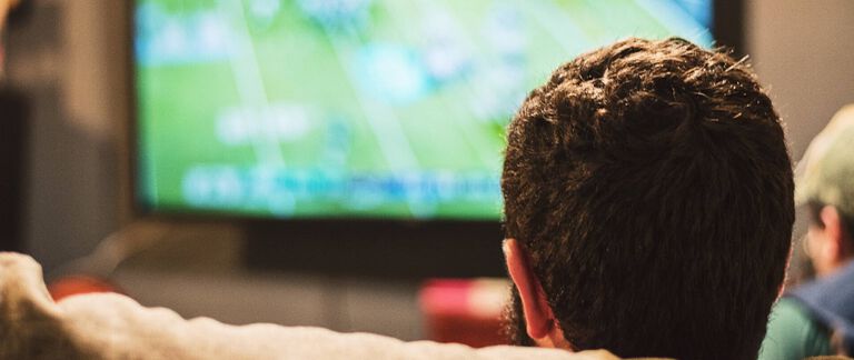 A man watching TV