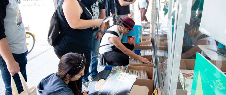 People looking through records.