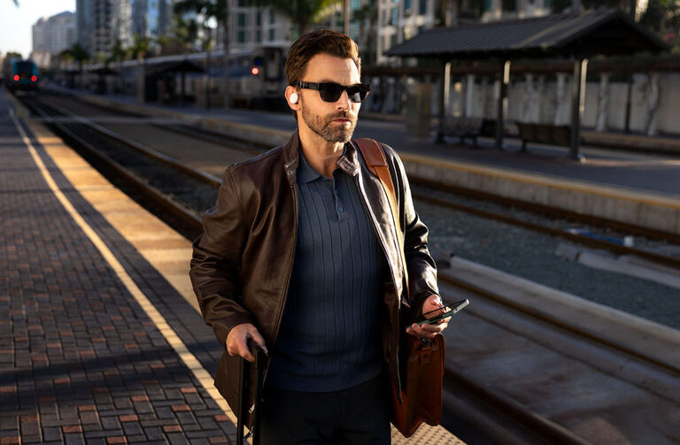 A man walking with headphones in