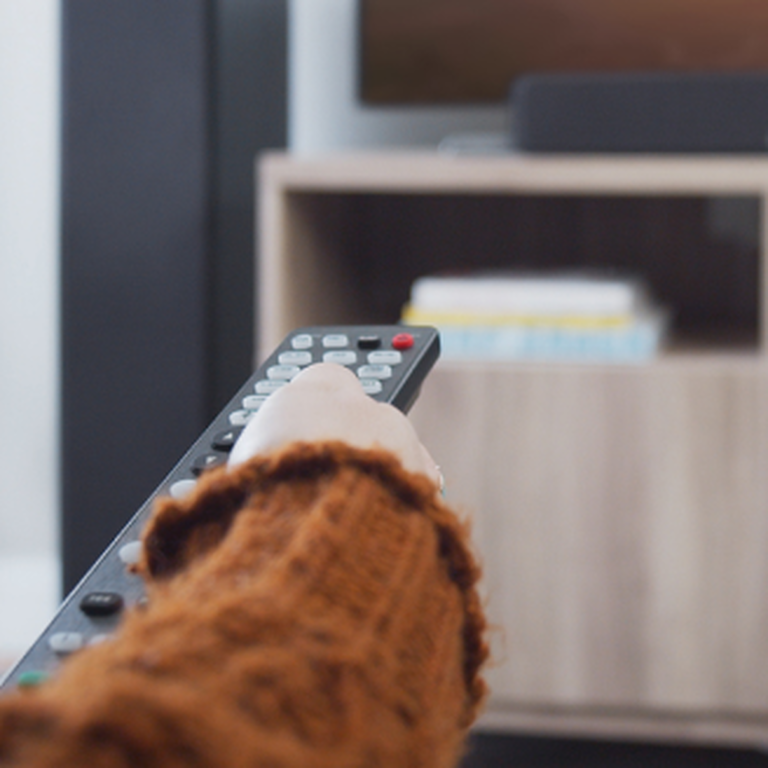 A girl holding a remote