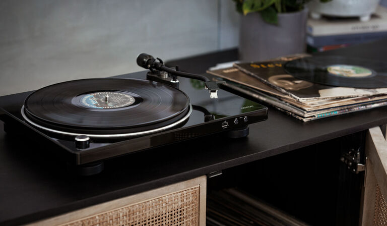 A vinyl record player on a table