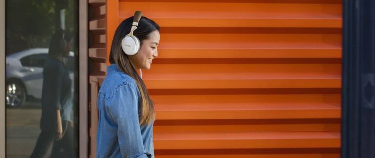 A woman listening to headphones