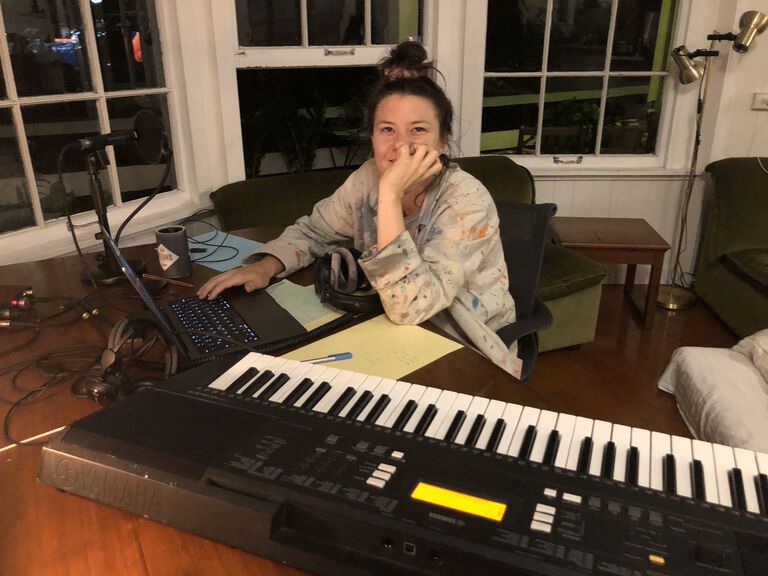 Kate Dillon at her home studio writing music