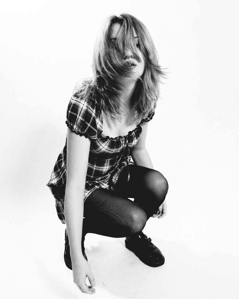 Bee Blackwell crouching