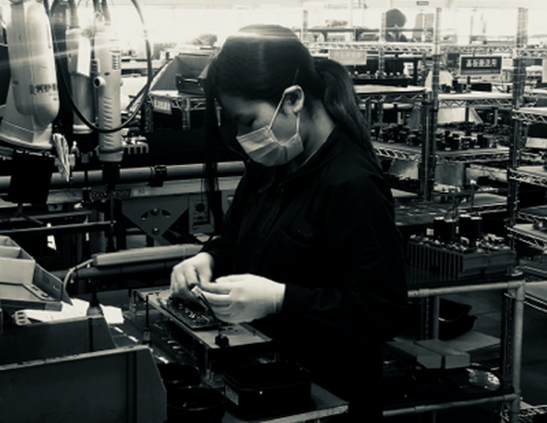 A woman making a Denon product