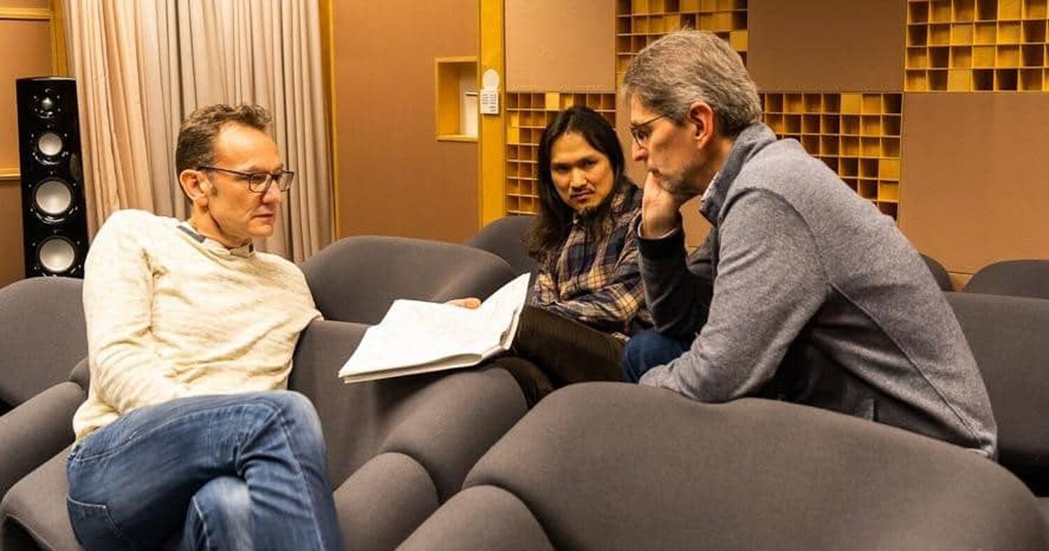 People reviewing a paper on a couch